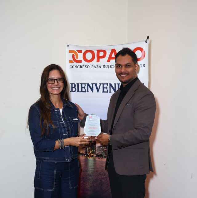Chiragx receiving the COPASO 2026 recognition plaque from the organizer