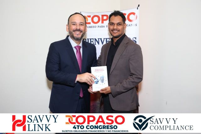 Chiragx and another speaker with the book Activos Digitales y Sistema Financiero at COPASO 2026