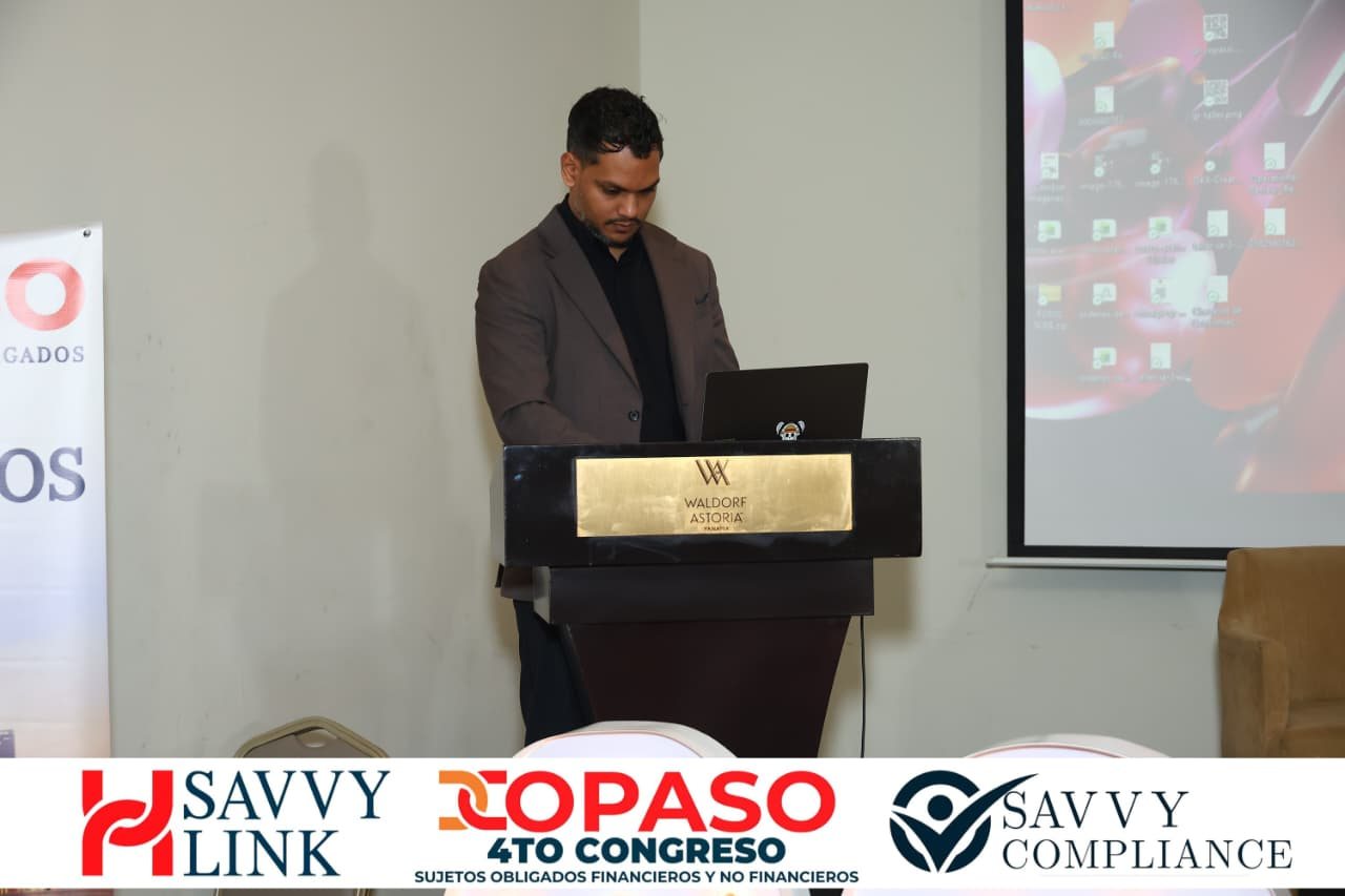 Chiragx at the COPASO 2026 lectern working on the laptop while the screen shows the images being generated