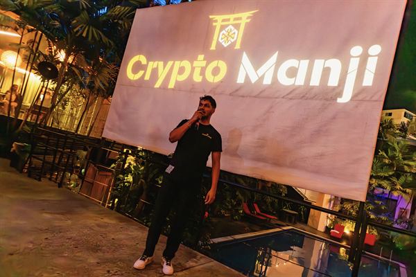 Chiragx, founder of CryptoManji, presenting the launch in front of the CryptoManji logo screen